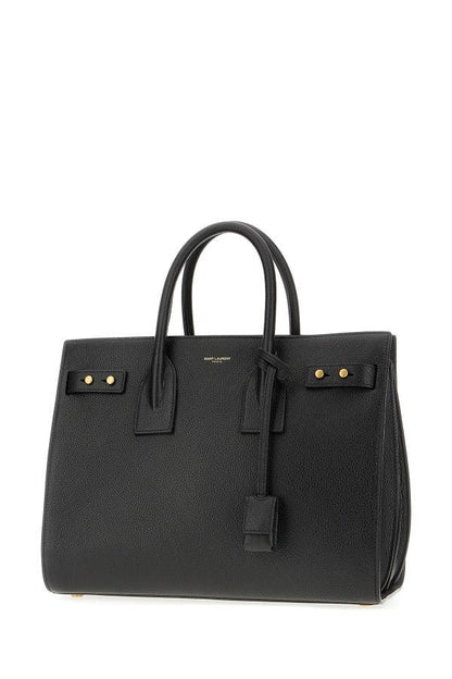 Box Handbag by Saint Laurent for women in pebbled calf leather black & print features an refined silhouette, showcasing a secure zipper, ample built-in-compartments, and versatile shoulder-strap, adjustable-strap, detachable-strap & handle for a sophisticated refined aesthetic.