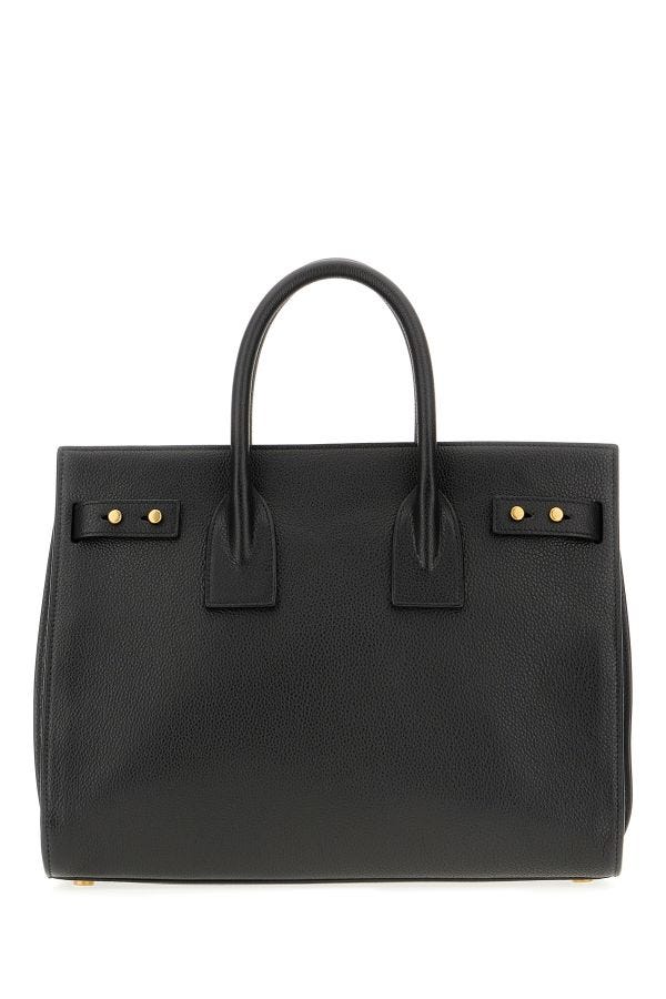 Box Handbag by Saint Laurent for women in pebbled calf leather black & print features a signature silhouette, showcasing a secure zipper and signature built-in-compartments with versatile shoulder-strap, adjustable-strap, detachable-strap & handle for a sophisticated look.