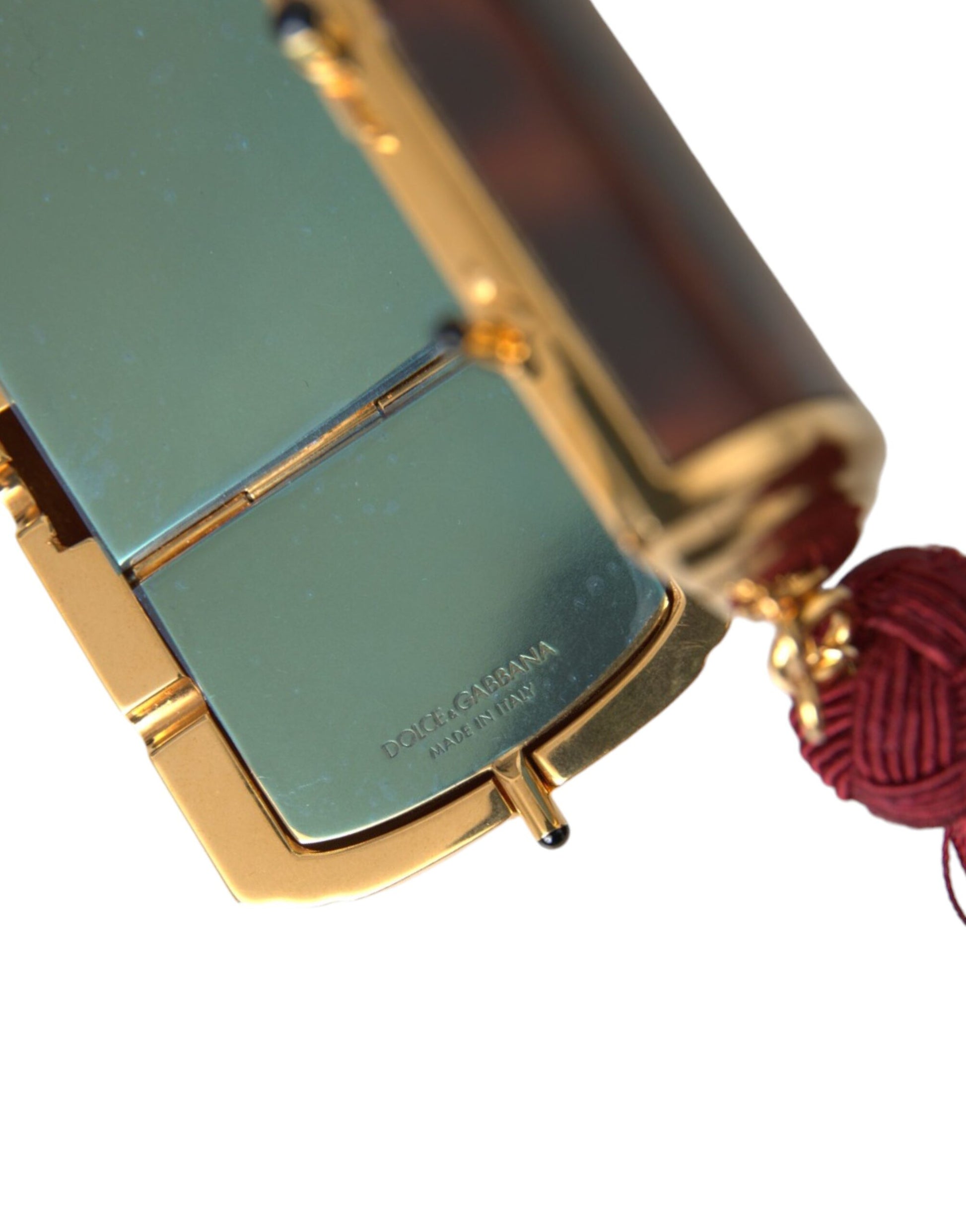 Mini Toiletry Bag by Dolce & Gabbana for women in leather & metal brown & gold features an distinguished Leather Metal Mini Toiletry Bag design with a secure clasp, distinguished , and versatile .