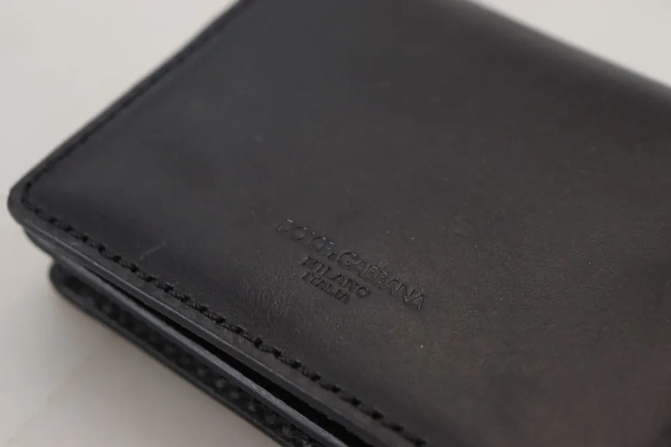 Wallet by Dolce & Gabbana for women in leather & metal black & silver showcases a discerning silhouette, artfully capturing the essence of Leather Metal Wallet with its functional compact-design bifold.