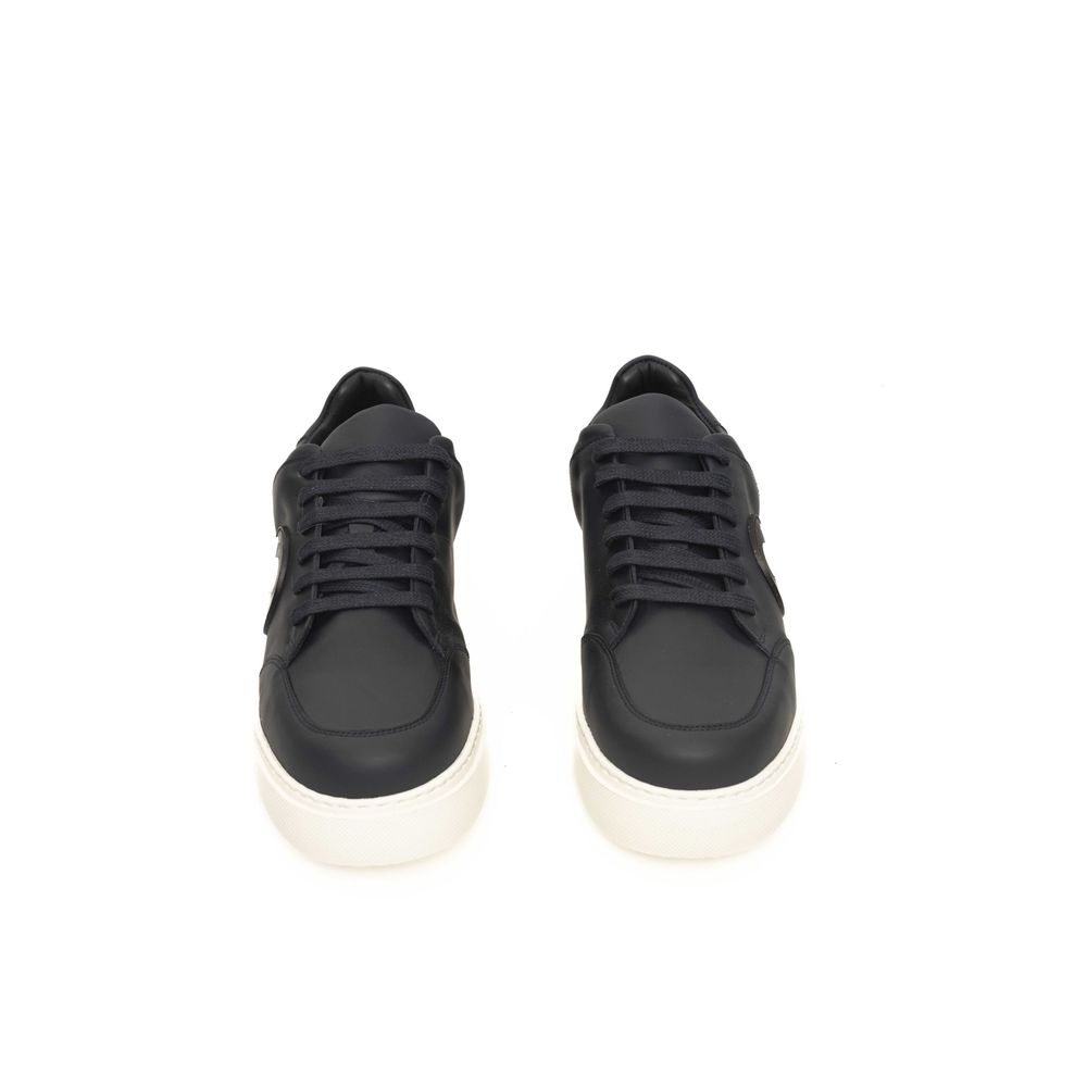 Sneakers by Cerruti 1881 for men in cowhide blue presents a sumptuous silhouette, artfully capturing the essence of the Men's Low Top Cowhide Sneakers with its sumptuous low-top style design.