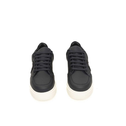 Sneakers by Cerruti 1881 for men in cowhide blue presents a sumptuous silhouette, artfully capturing the essence of the Men's Low Top Cowhide Sneakers with its sumptuous low-top style design.