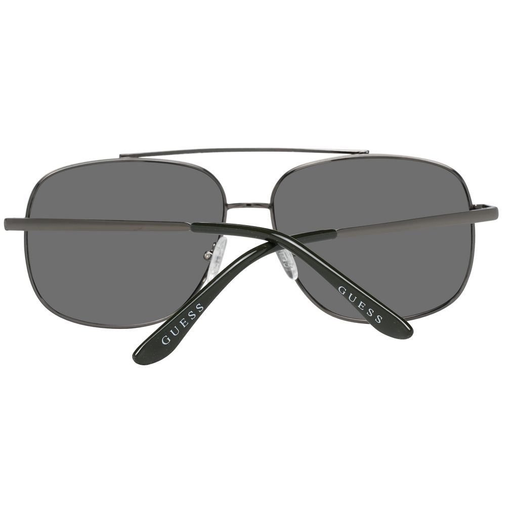 Sunglasses by Guess for men in metal gray features an lustrous aviator full-rim frame design with gunmetal coloured frame detailing and mirrored category-3-dark-tint lens for a lustrous aesthetic.