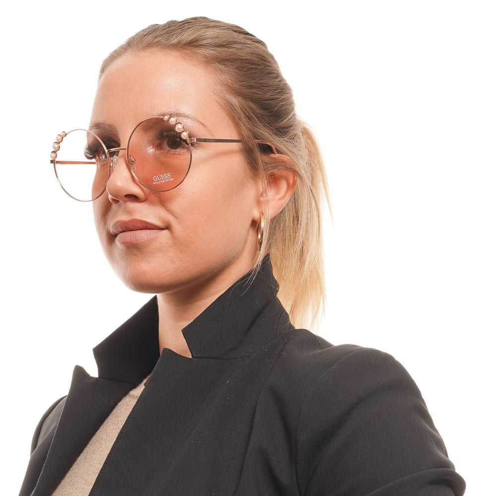 Sunglasses by Guess for women in rose-gold features an ethereal full-rim round frame design with rose-gold coloured frame frames and non-polarized category-1-light-tint lens for a ethereal finish.