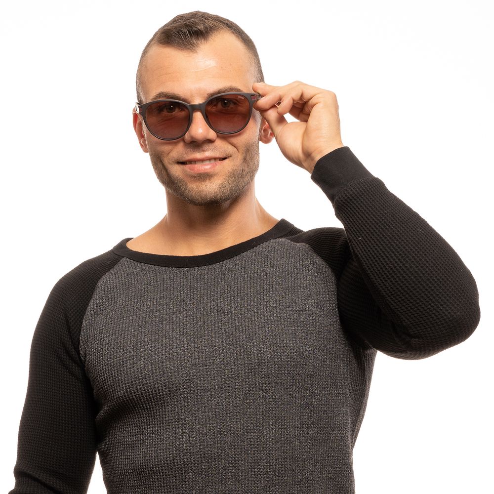 This Sunglasses by BMW for men in brown presents a sumptuous silhouette, showcasing a sumptuous full-rim round frame design in brown coloured frame and high-performance category-2-medium-tint lens.