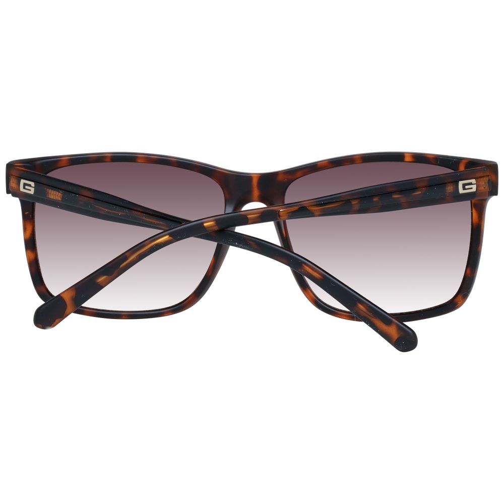 Sunglasses by Guess for men in brown showcases a ethereal silhouette, featuring brown coloured frame full-rim square frame design with gradient category-3-dark-tint lens for a ethereal finish.