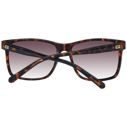 Sunglasses by Guess for men in brown showcases a ethereal silhouette, featuring brown coloured frame full-rim square frame design with gradient category-3-dark-tint lens for a ethereal finish.