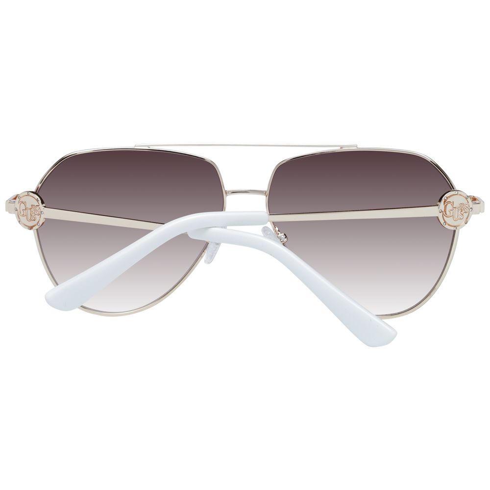 Sunglasses by Guess for women in gold showcases a ethereal silhouette, featuring gold coloured frame aviator full-rim frame design with gradient category-3-dark-tint lens for a ethereal finish.