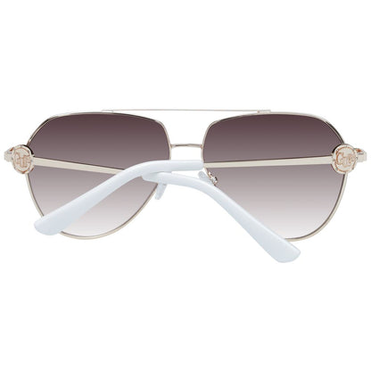 Sunglasses by Guess for women in gold showcases a ethereal silhouette, featuring gold coloured frame aviator full-rim frame design with gradient category-3-dark-tint lens for a ethereal finish.
