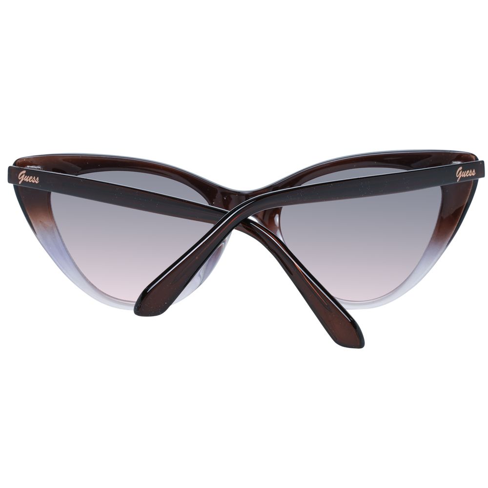 This Sunglasses by Guess for women in brown presents a sumptuous silhouette, showcasing a sumptuous full-rim cat-eye frame design in brown coloured frame and high-performance gradient category-2-medium-tint lens.