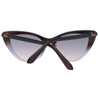 This Sunglasses by Guess for women in brown presents a sumptuous silhouette, showcasing a sumptuous full-rim cat-eye frame design in brown coloured frame and high-performance gradient category-2-medium-tint lens.