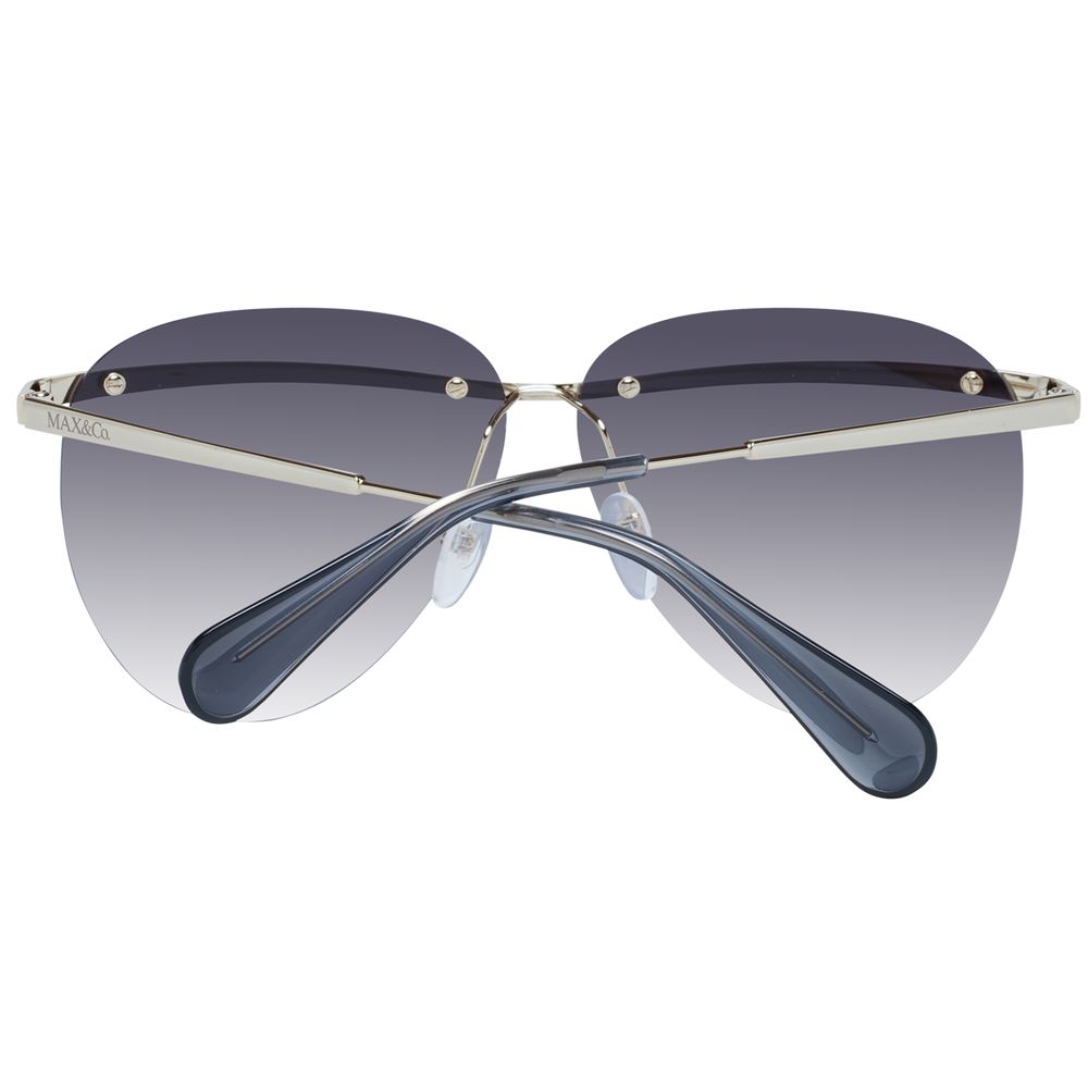 This Sunglasses by Max & Co for women in gold presents a sumptuous silhouette, showcasing a sumptuous aviator rimless frame design in gold coloured frame and high-performance gradient category-2-medium-tint lens.