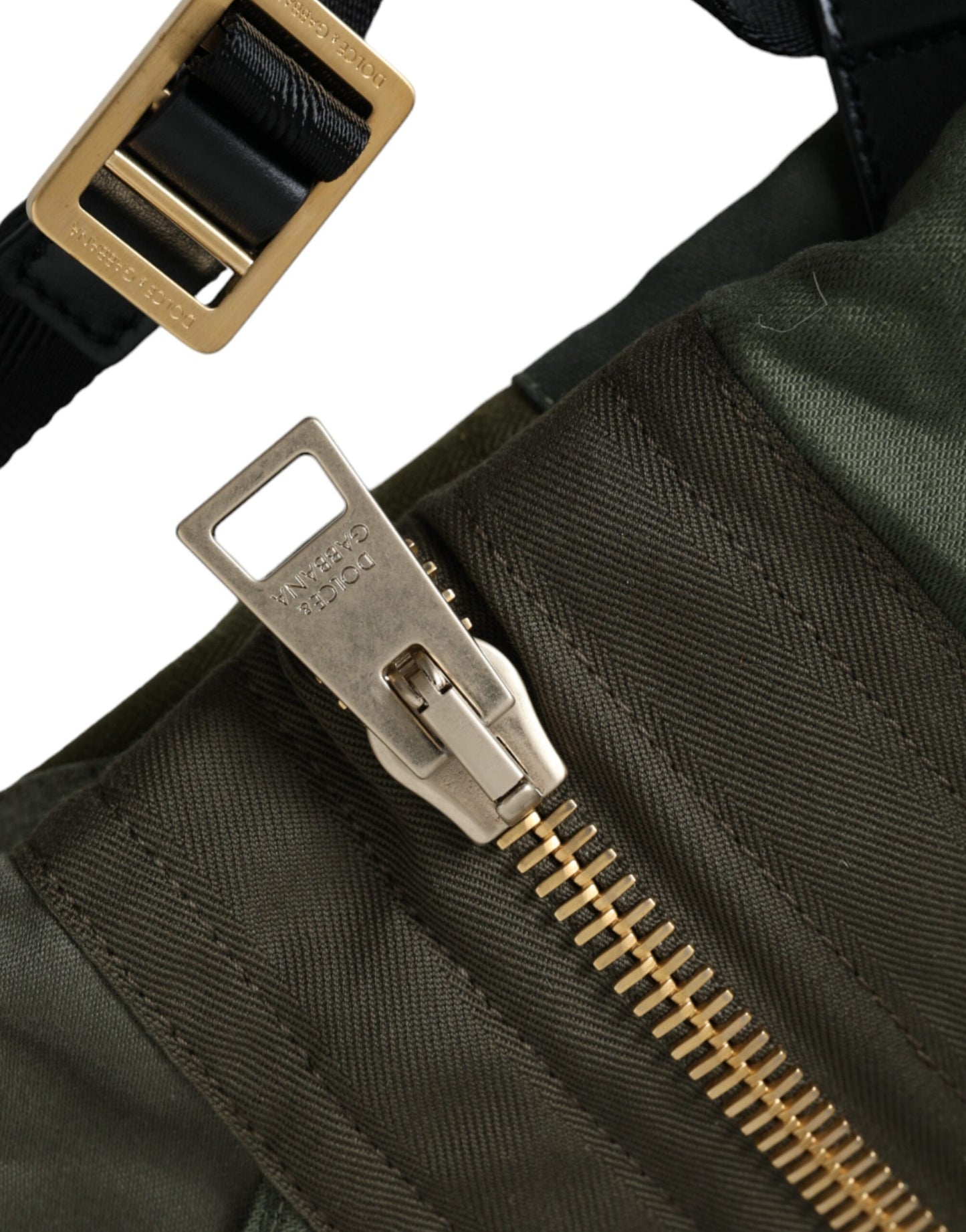 Large Drawstring Rucksack Backpack by Dolce & Gabbana for men in canvas military-green, camouflage & patchwork showcases an architectural Canvas Large Drawstring Rucksack Backpack design, featuring a secure drawstring, ample internal-pockets, and architectural backpack-strap for a sophisticated look.