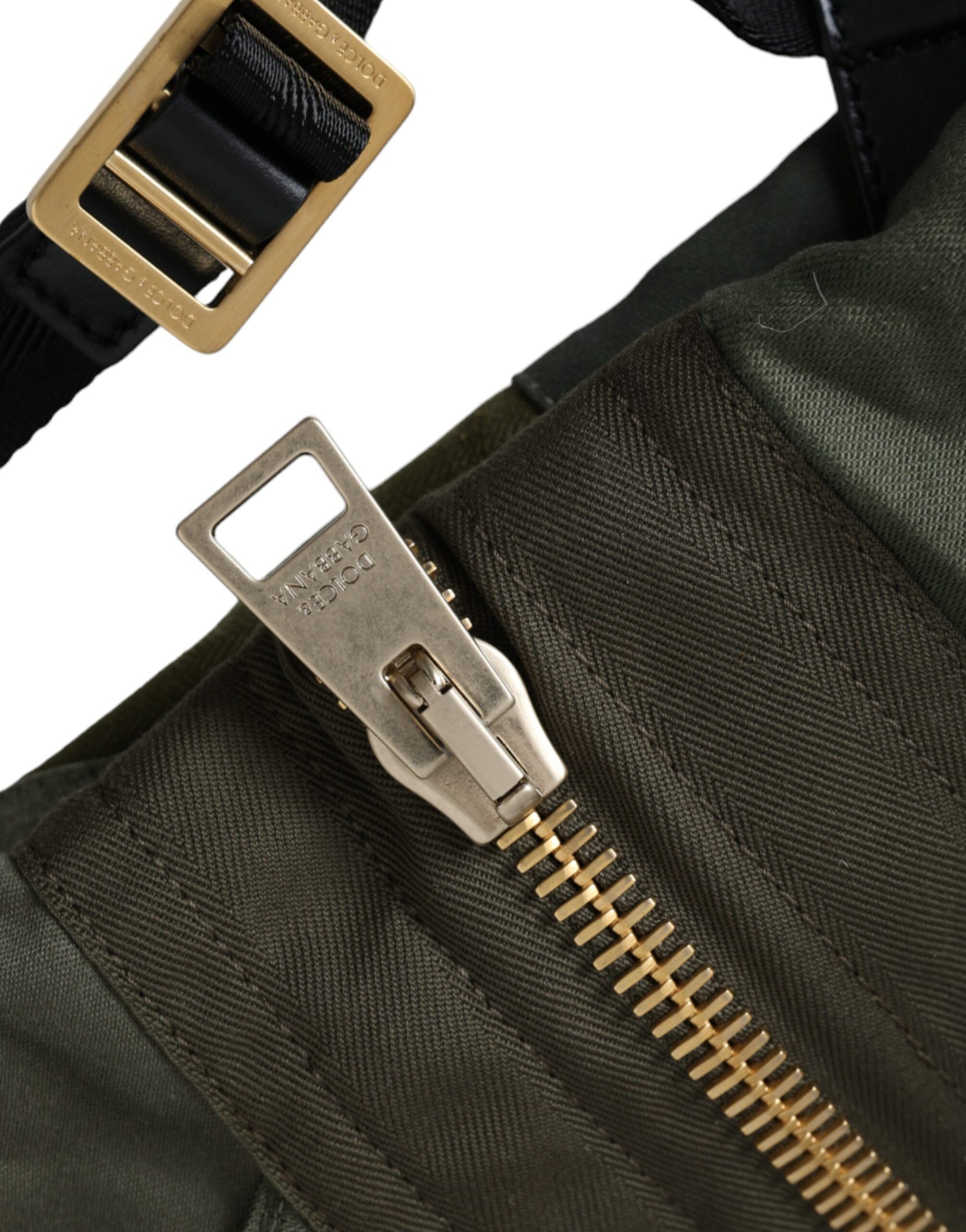 Large Drawstring Rucksack Backpack by Dolce & Gabbana for men in canvas military-green, camouflage & patchwork showcases an architectural Canvas Large Drawstring Rucksack Backpack design, featuring a secure drawstring, ample internal-pockets, and architectural backpack-strap for a sophisticated look.