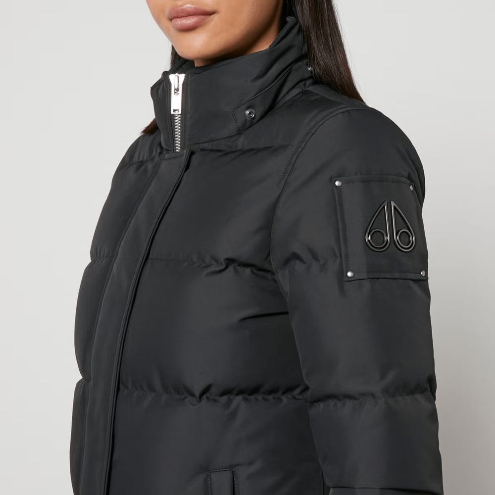 Hooded Jacket by Moose Knuckles for women in polyester goose down & faux fur black presents a authentic silhouette, artfully detailed with a authentic hooded neckline and functional pockets, hooded & insulated for a premium authentic finish.