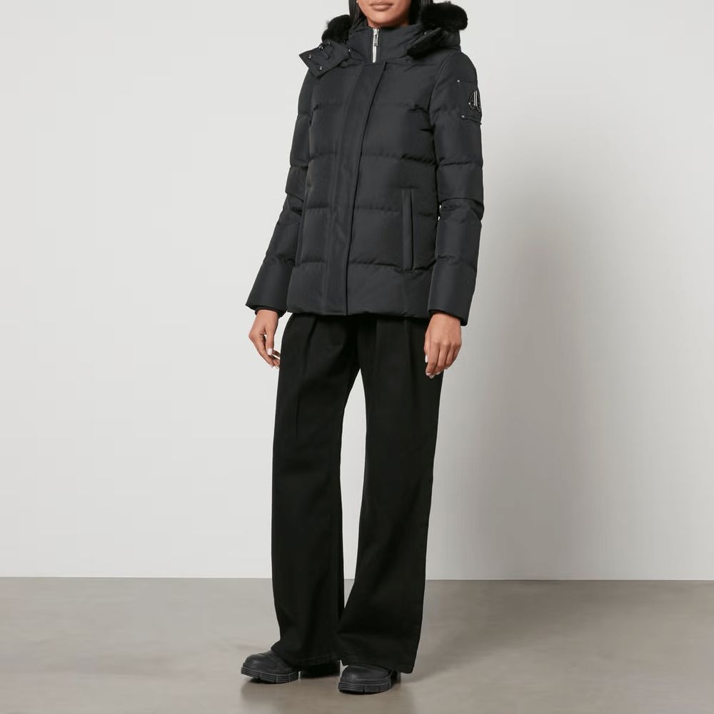 Hooded Jacket by Moose Knuckles for women in polyester goose down & faux fur black presents a impeccable silhouette, showcasing distinct pockets, hooded & insulated and a impeccable hooded neckline for a sophisticated finish.