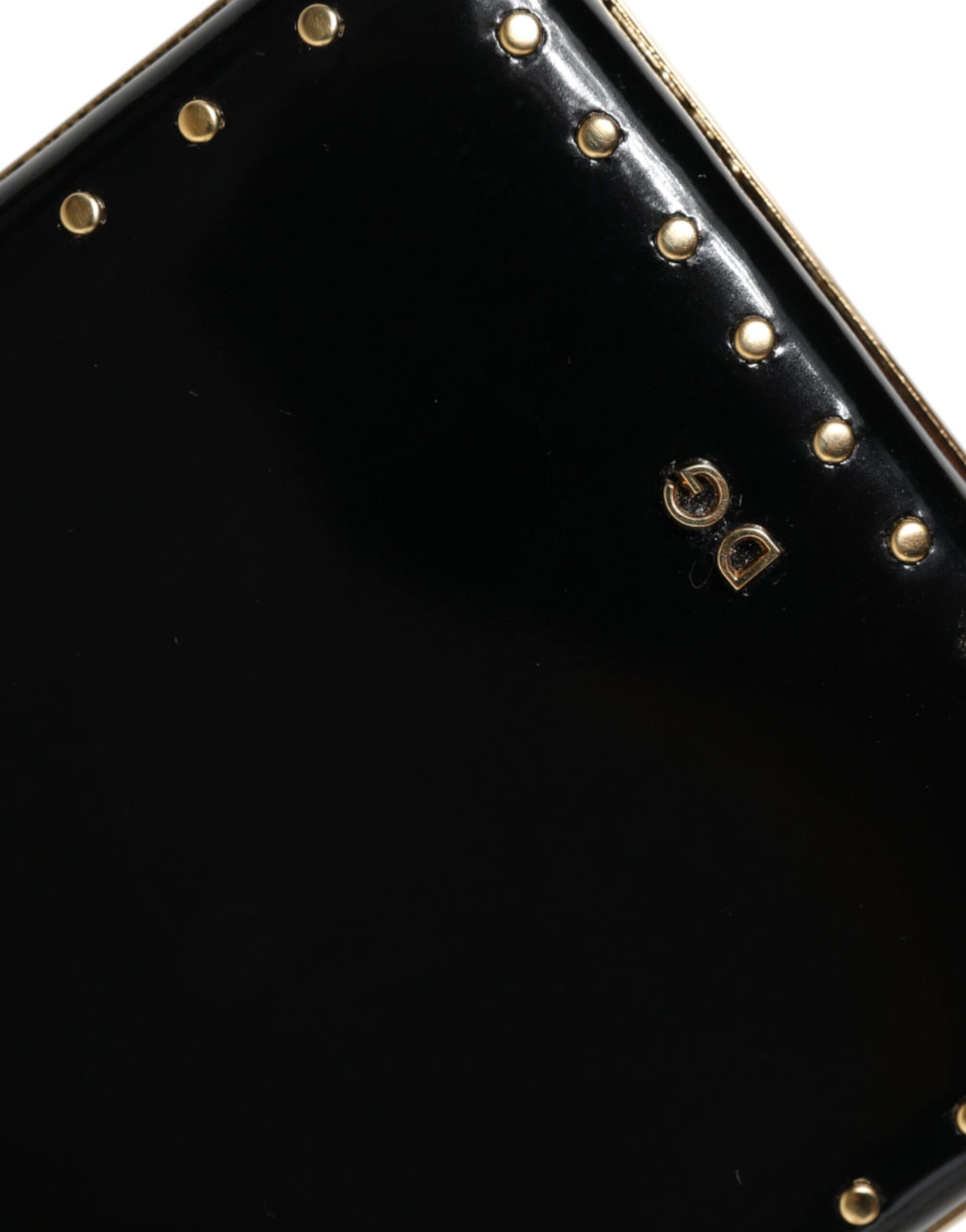 Compact Evening Box Clutch Convertible Handbag by Dolce & Gabbana for women in leather & brass black & gold presents a enviable design with a secure , ample , and versatile for a sophisticated look.