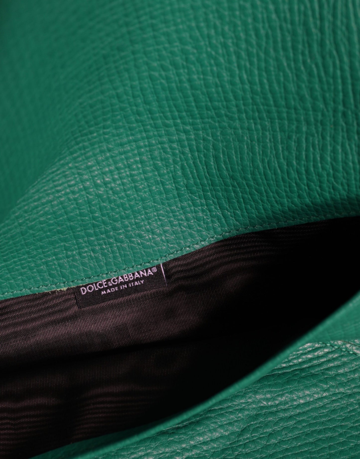 Mini Pouch Clutch Handbag by Dolce & Gabbana for women in leather & metal green showcases a sculptural silhouette, featuring a secure snap & button, ample , and versatile for a sculptural finish.
