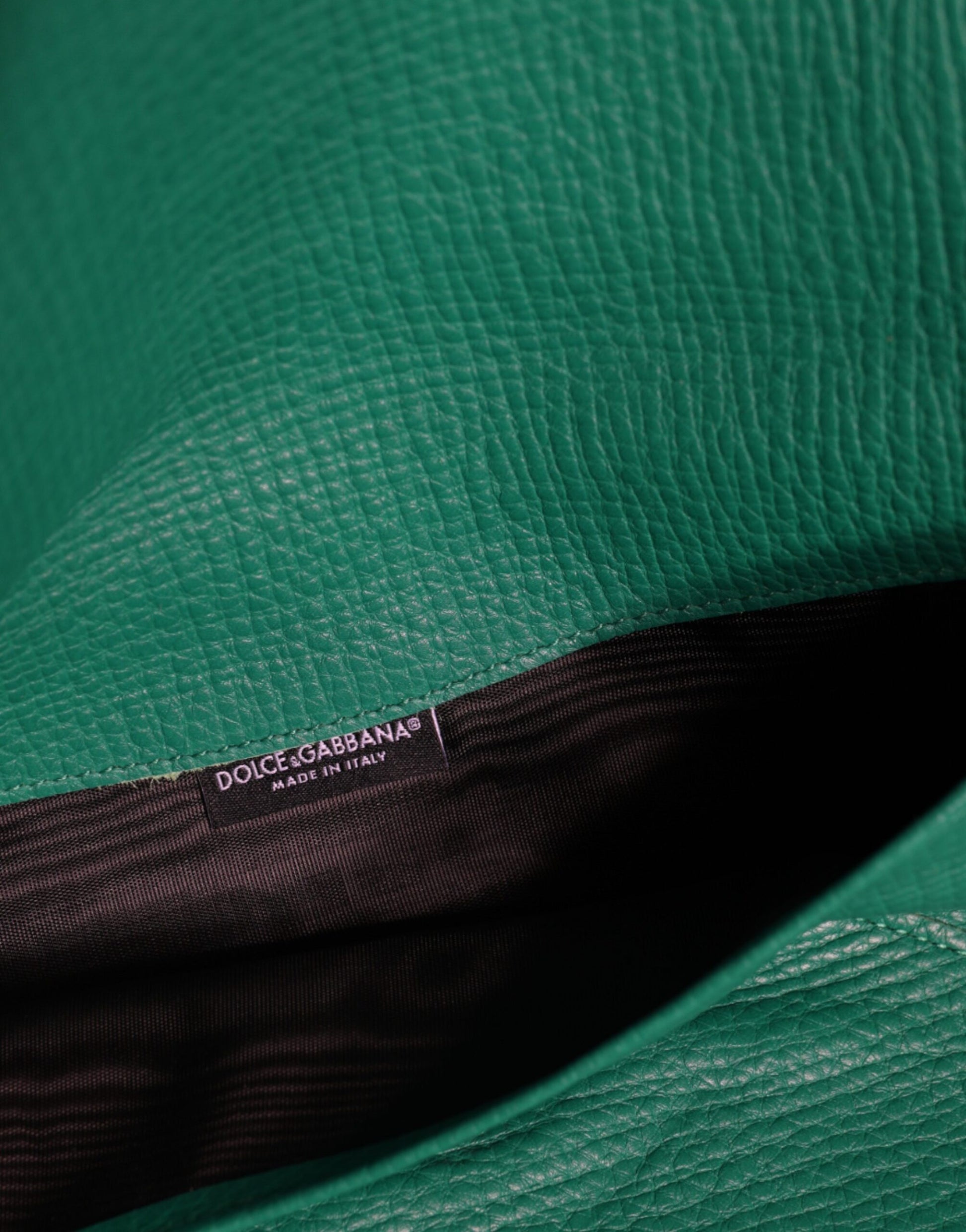 Mini Pouch Clutch Handbag by Dolce & Gabbana for women in leather & metal green showcases a sculptural silhouette, featuring a secure snap & button, ample , and versatile for a sculptural finish.
