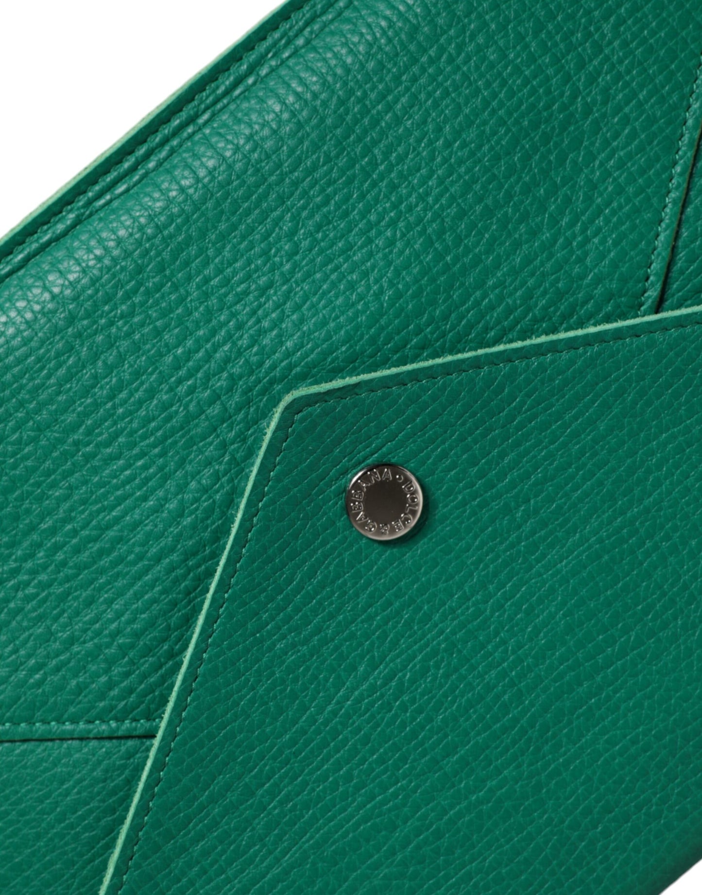 Mini Pouch Clutch Handbag by Dolce & Gabbana for women in leather & metal green features a architectural silhouette, showcasing a secure snap & button, ample , and versatile for a architectural finish.