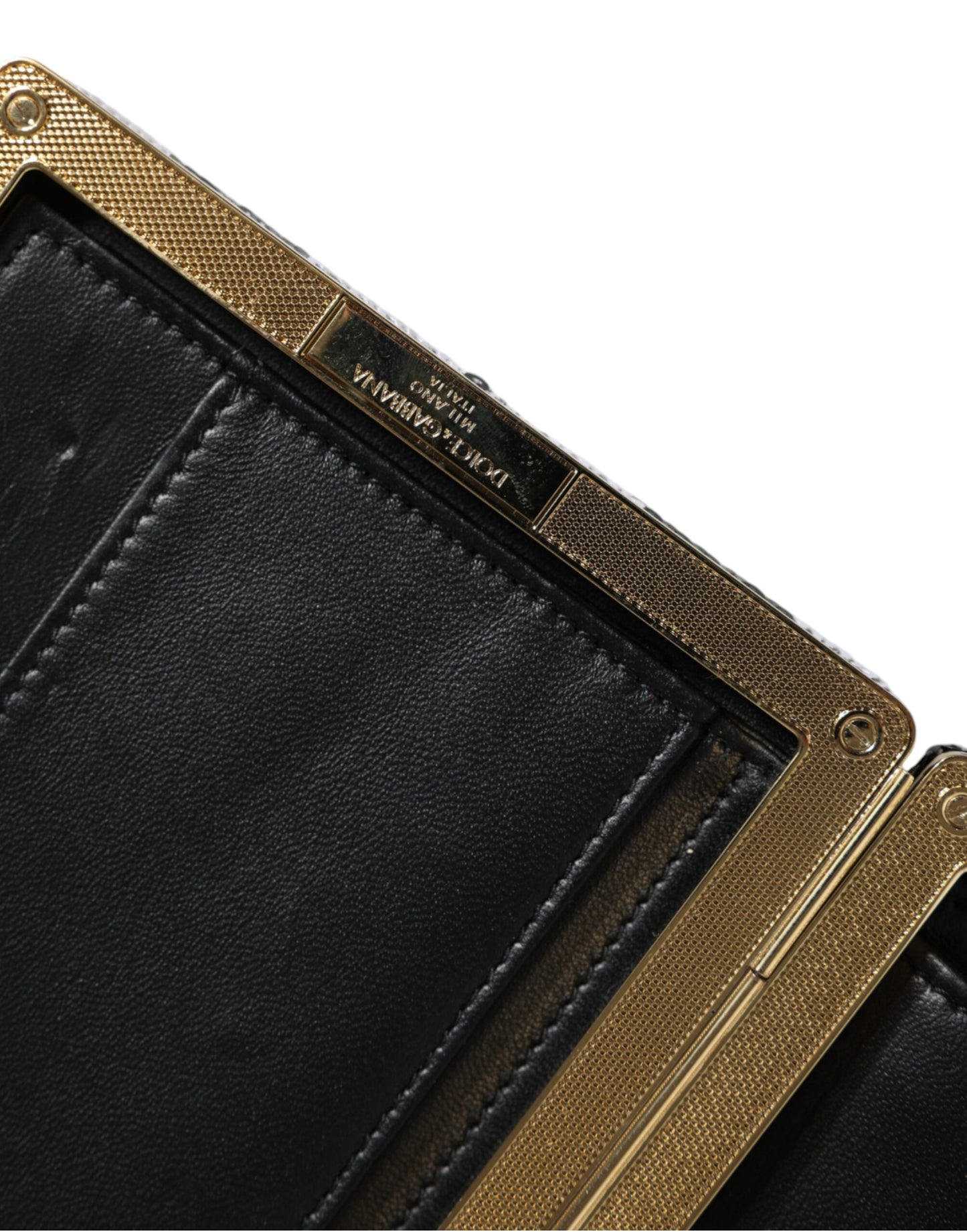 Compact Evening Box Clutch Convertible Handbag by Dolce & Gabbana for women in goat leather & aluminium black, gold & white features a polished silhouette with a secure , ample cardholder, and polished for a sophisticated look.