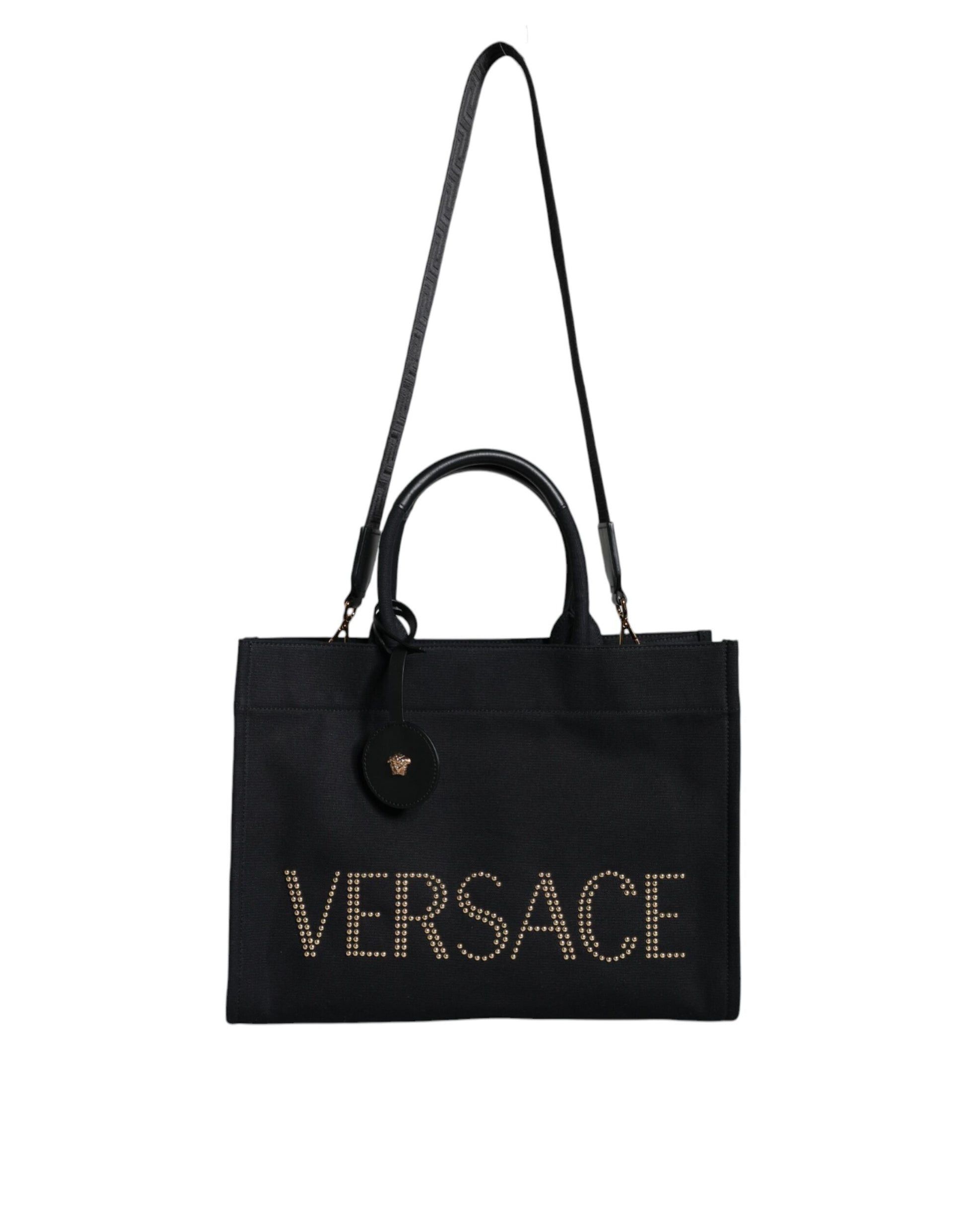 Crossbody Tote Bag by Versace for women in canvas & leather black features a jet-set sophisticated Canvas & Leather Crossbody Tote Bag design with a secure zipper, ample , and versatile crossbody-strap, shoulder-strap, handle, adjustable-strap & detachable-strap for a jet-set sophisticated finish.