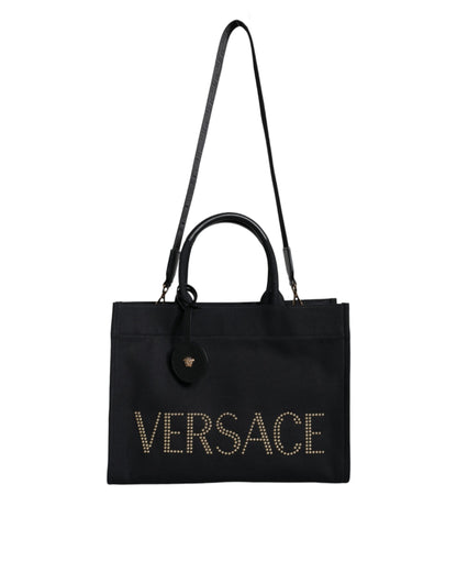 Crossbody Tote Bag by Versace for women in canvas & leather black features a jet-set sophisticated Canvas & Leather Crossbody Tote Bag design with a secure zipper, ample , and versatile crossbody-strap, shoulder-strap, handle, adjustable-strap & detachable-strap for a jet-set sophisticated finish.