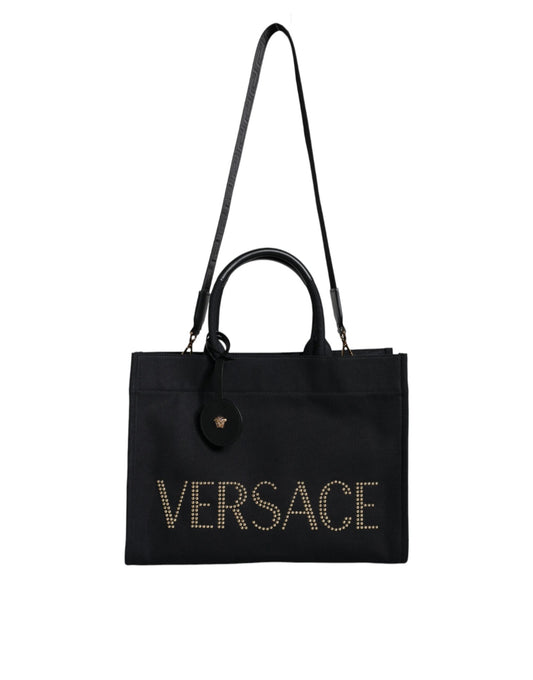 Crossbody Tote Bag by Versace for women in canvas & leather black features a jet-set sophisticated Canvas & Leather Crossbody Tote Bag design with a secure zipper, ample , and versatile crossbody-strap, shoulder-strap, handle, adjustable-strap & detachable-strap for a jet-set sophisticated finish.