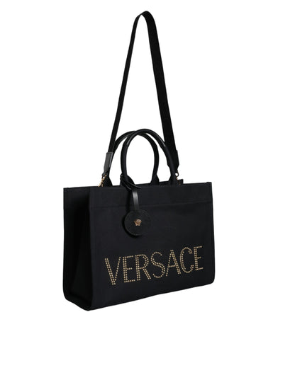 This Crossbody Tote Bag by Versace for women in canvas & leather black features an jet-set Canvas & Leather Crossbody Tote Bag design with a secure zipper, ample , and jet-set crossbody-strap, shoulder-strap, handle, adjustable-strap & detachable-strap.