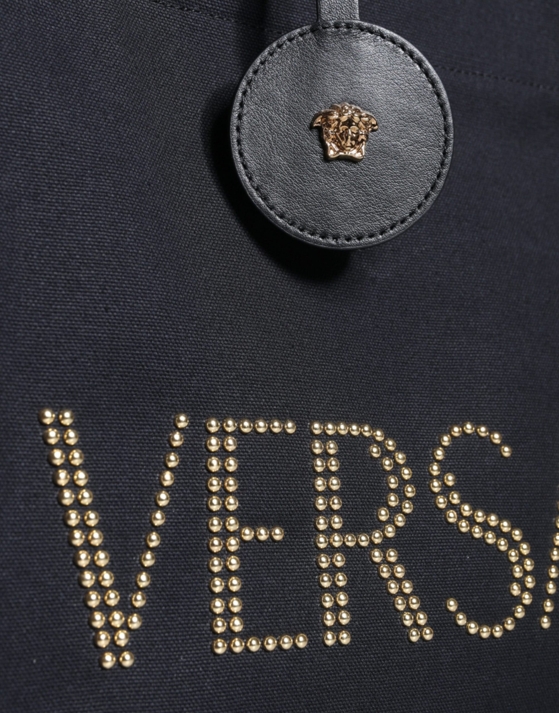 Crossbody Tote Bag by Versace for women in canvas & leather black showcases a statuesque Canvas & Leather Crossbody Tote Bag design, featuring a secure zipper, ample , and versatile crossbody-strap, shoulder-strap, handle, adjustable-strap & detachable-strap for a statuesque finish.
