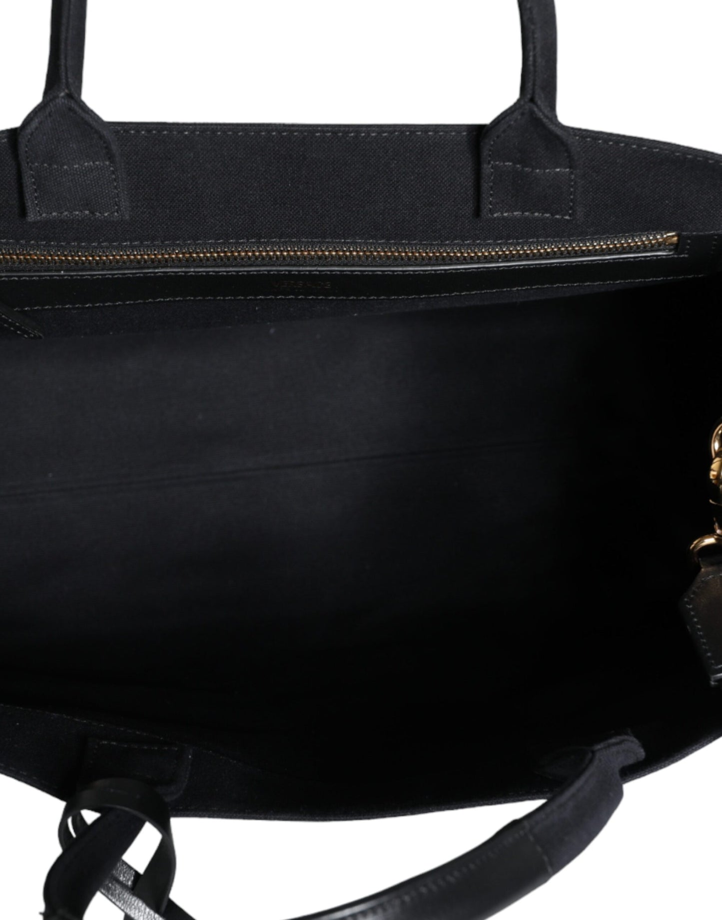 Crossbody Tote Bag by Versace for women in canvas & leather black features a jet-set Canvas & Leather Crossbody Tote Bag design, complete with a secure zipper, ample , and versatile crossbody-strap, shoulder-strap, handle, adjustable-strap & detachable-strap for a jet-set look.