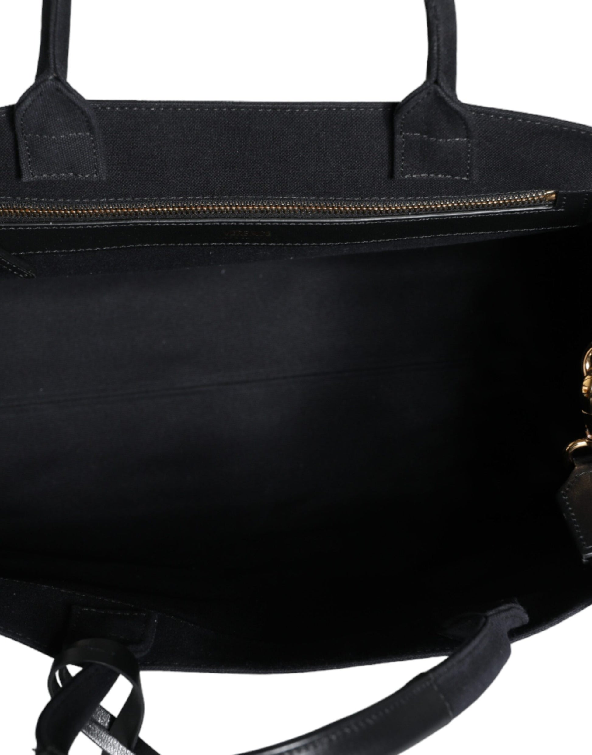 Crossbody Tote Bag by Versace for women in canvas & leather black features a jet-set Canvas & Leather Crossbody Tote Bag design, complete with a secure zipper, ample , and versatile crossbody-strap, shoulder-strap, handle, adjustable-strap & detachable-strap for a jet-set look.
