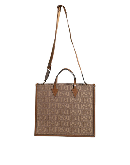 Crossbody Tote Bag by Versace for women in leather & cotton brown, white & jacquard features a jet-set sophisticated Leather & Cotton Crossbody Tote Bag design with a secure zipper, ample , and versatile crossbody-strap, shoulder-strap, handle, adjustable-strap & detachable-strap for a jet-set sophisticated finish.