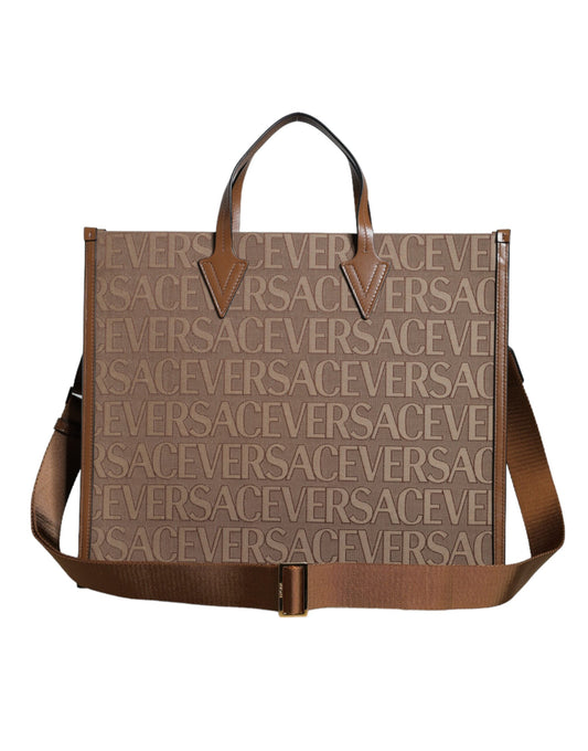 Crossbody Tote Bag by Versace for women in leather & cotton brown, white & jacquard features a jet-set Leather & Cotton Crossbody Tote Bag design, complete with a secure zipper, ample , and versatile crossbody-strap, shoulder-strap, handle, adjustable-strap & detachable-strap for a jet-set look.