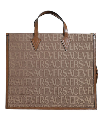 This Crossbody Tote Bag by Versace for women in leather & cotton brown, white & jacquard features an jet-set Leather & Cotton Crossbody Tote Bag design with a secure zipper, ample , and jet-set crossbody-strap, shoulder-strap, handle, adjustable-strap & detachable-strap.