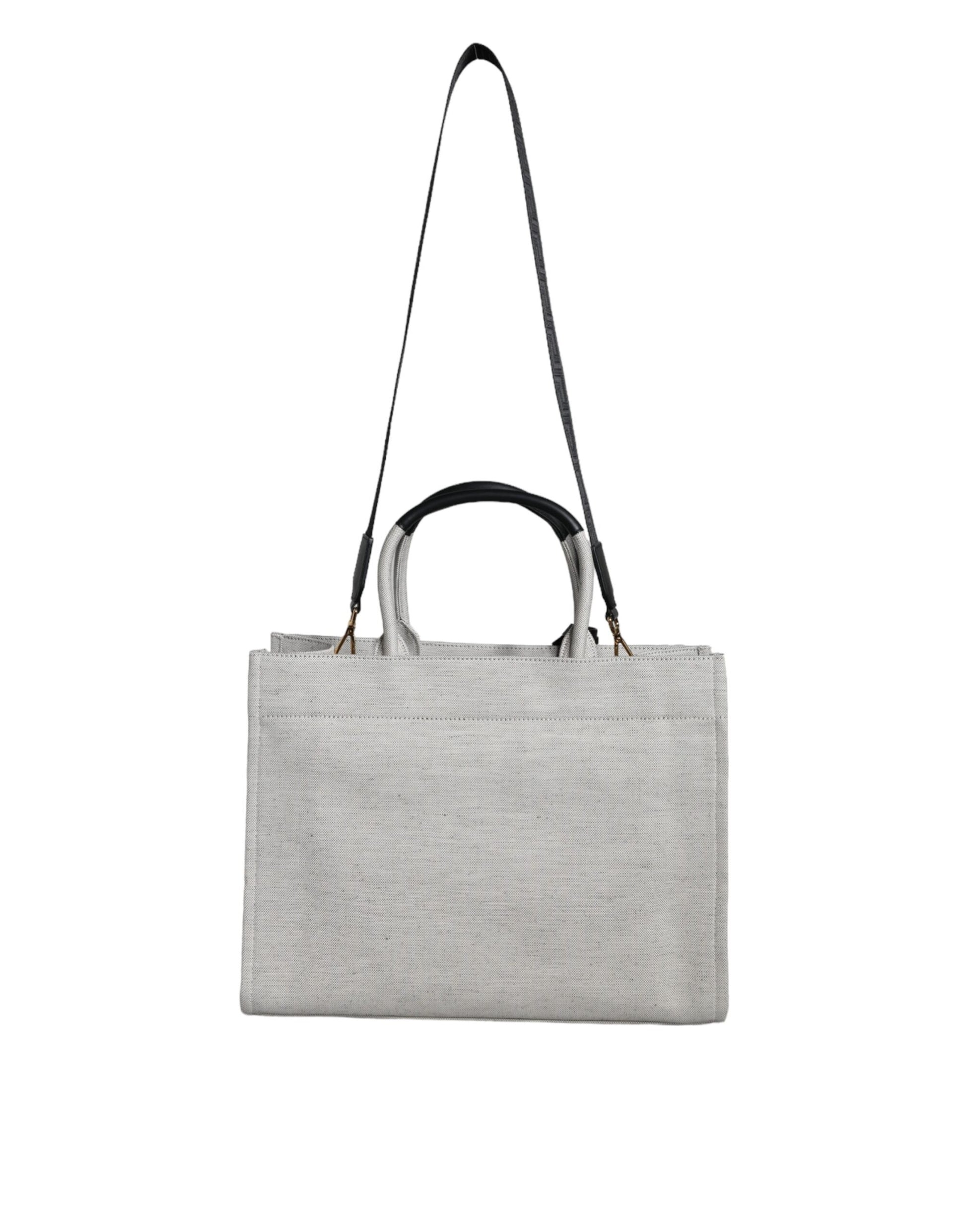 Crossbody Tote Bag by Versace for women in leather & canvas black & white showcases a statuesque Crisp Leather & Canvas Crossbody Tote Bag design, featuring a secure zipper, ample , and versatile crossbody-strap, shoulder-strap, handle, adjustable-strap & detachable-strap for a statuesque finish.