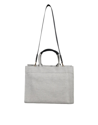 Crossbody Tote Bag by Versace for women in leather & canvas black & white showcases a statuesque Crisp Leather & Canvas Crossbody Tote Bag design, featuring a secure zipper, ample , and versatile crossbody-strap, shoulder-strap, handle, adjustable-strap & detachable-strap for a statuesque finish.