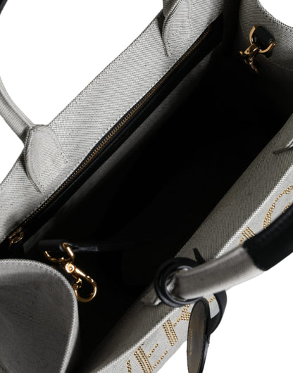 Crossbody Tote Bag by Versace for women in leather & canvas black & white features a jet-set Crisp Leather & Canvas Crossbody Tote Bag design, complete with a secure zipper, ample , and versatile crossbody-strap, shoulder-strap, handle, adjustable-strap & detachable-strap for a jet-set look.