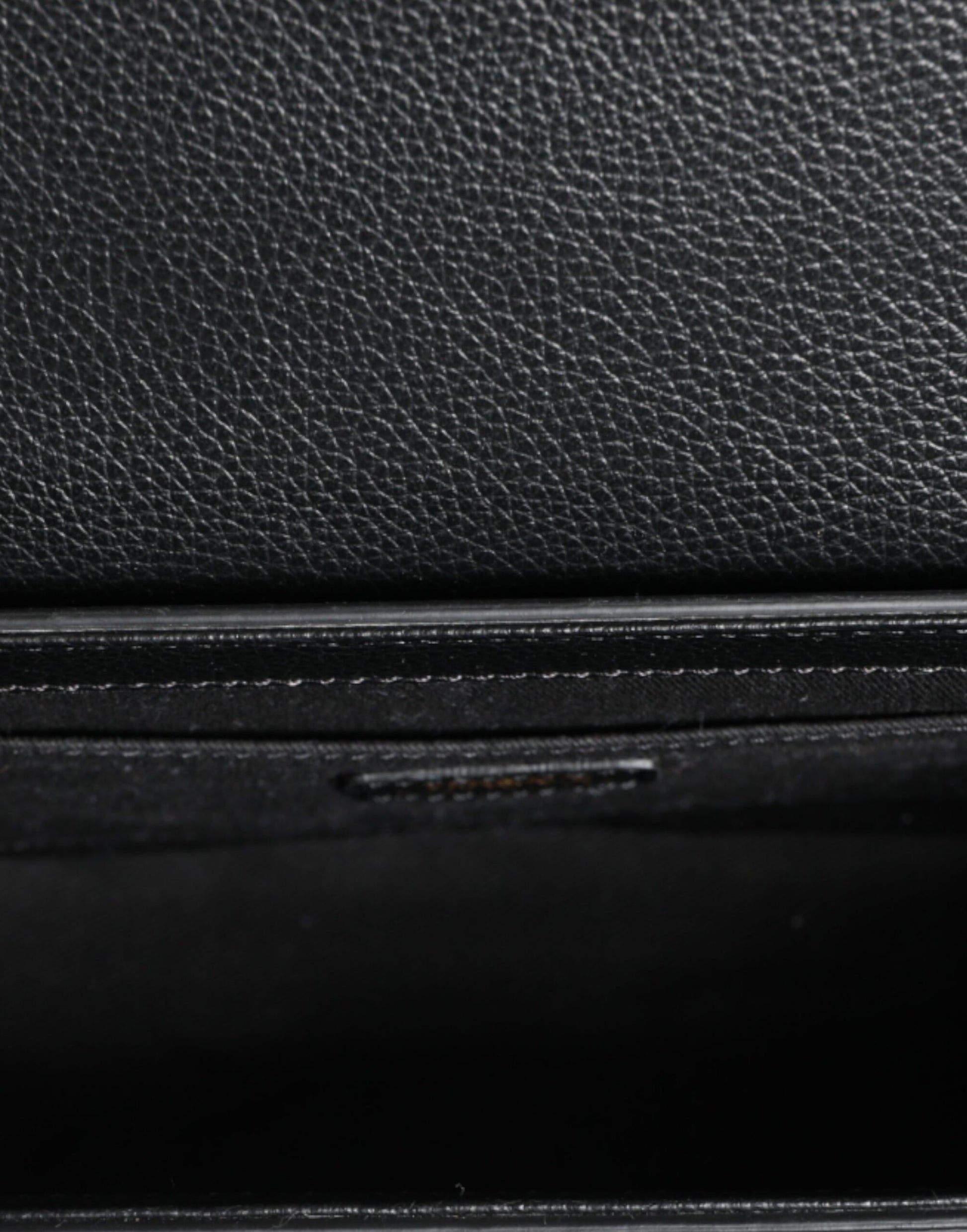 Compact 2-in-1 Shoulder & Crossbody Bag by Versace for women in calf leather & cotton black features a statuesque silhouette, showcasing a secure magnetic and statuesque internal-pockets with versatile crossbody-strap, shoulder-strap, adjustable-strap & handle for a statuesque finish.