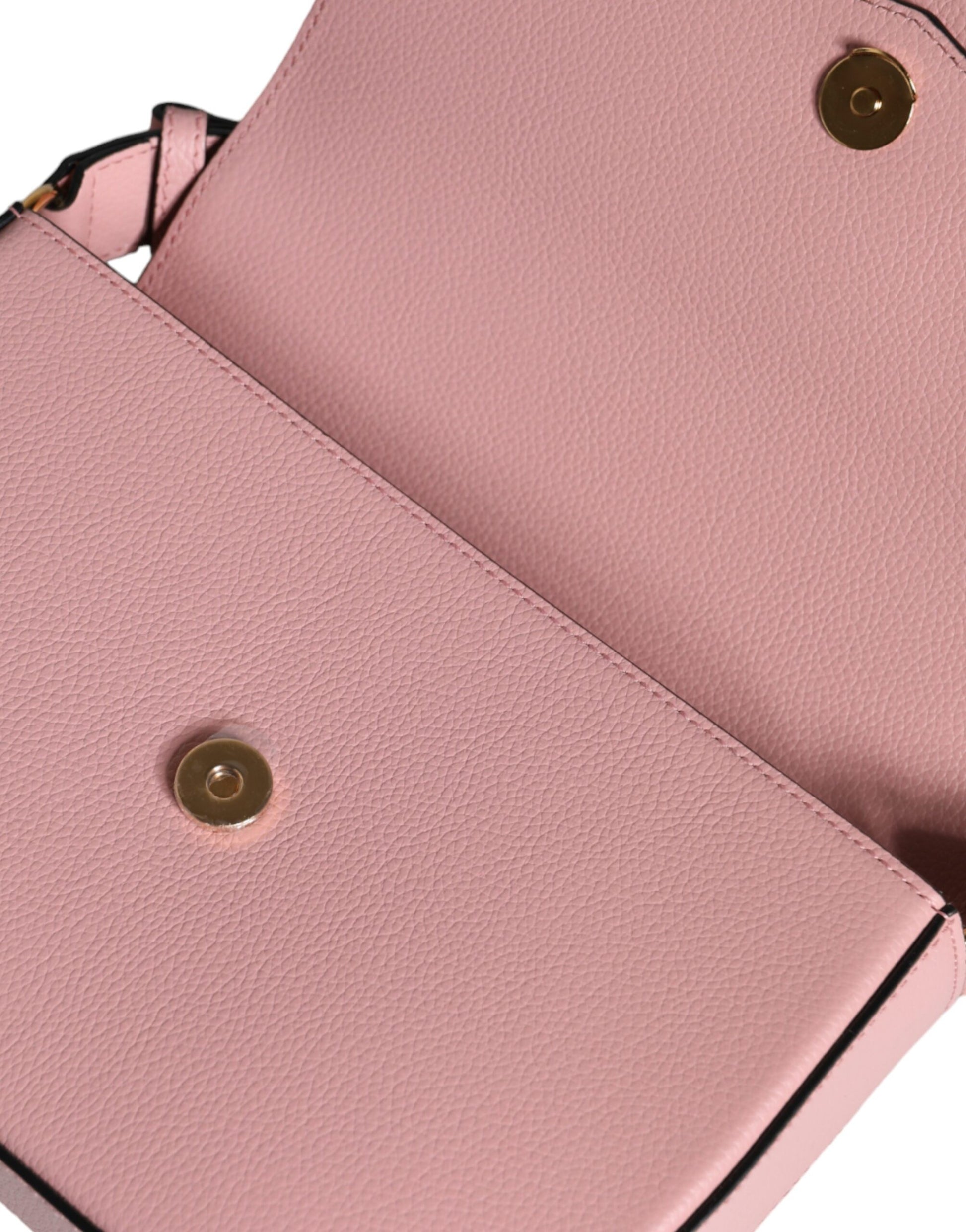 Compact 2-in-1 Shoulder & Crossbody Bag by Versace for women in calf leather viscose & cotton black & pink features an effortlessly chic silhouette with a secure magnetic, ample internal-pockets, and versatile crossbody-strap, shoulder-strap, adjustable-strap & handle for effortlessly chic everyday luxury.