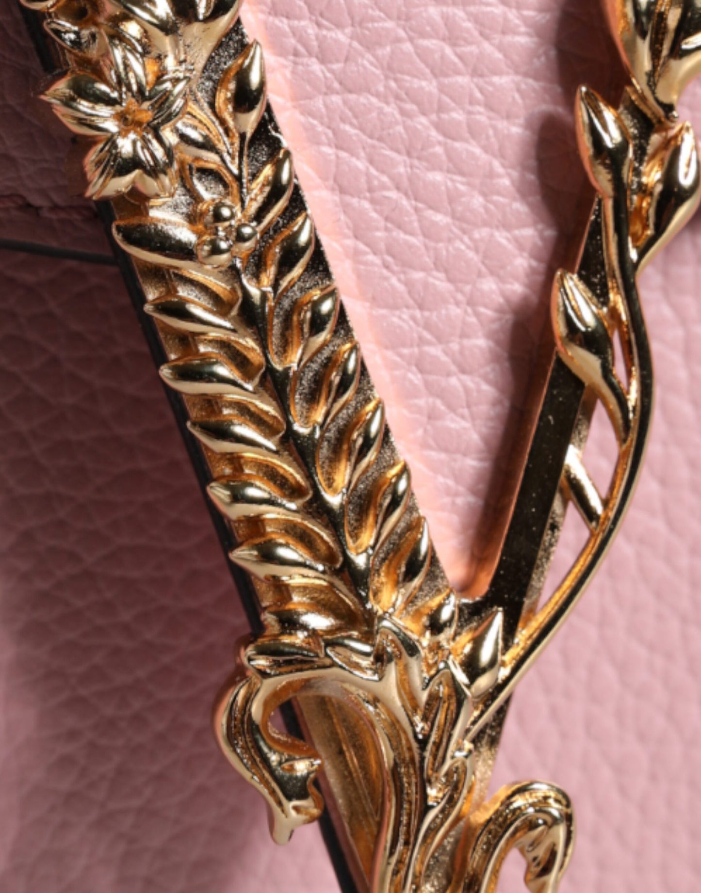 Compact 2-in-1 Shoulder & Crossbody Bag by Versace for women in calf leather viscose & cotton black & pink features a stately silhouette, showcasing a secure magnetic, ample internal-pockets, and stately crossbody-strap, shoulder-strap, adjustable-strap & handle for a stately finish.