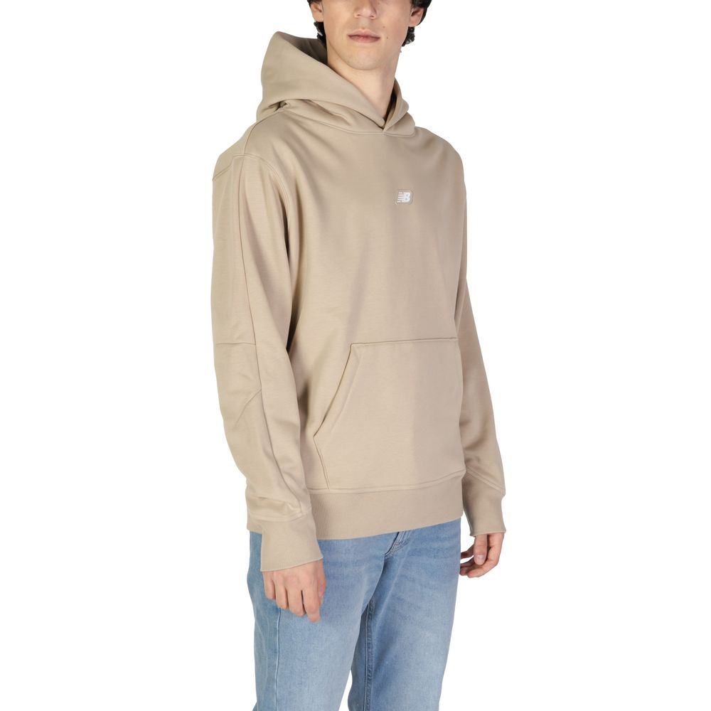 Sweater by New Balance for men in cotton polyester beige showcases an masterful silhouette, artfully detailed with a masterful and for a sophisticated, premium finish.