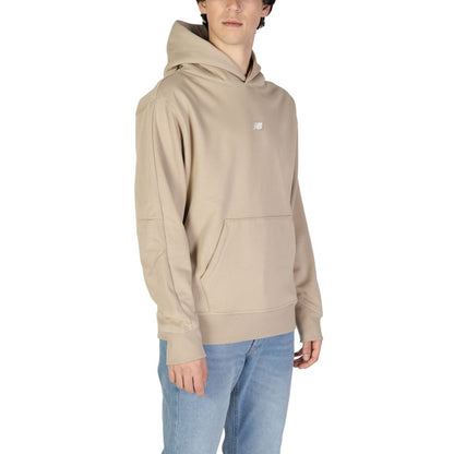 Sweater by New Balance for men in cotton polyester beige showcases an masterful silhouette, artfully detailed with a masterful and for a sophisticated, premium finish.