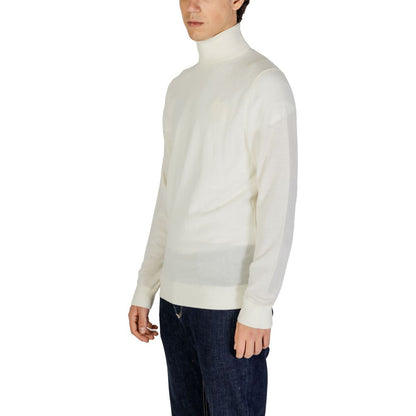 Sweater by Calvin Klein Jeans for men in wool cream features an tactile silhouette, showcasing a sophisticated turtle high-collar neckline and tactile for a refined finish.