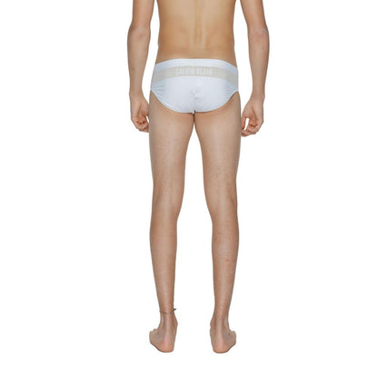 Swim Briefs by Calvin Klein for men in stretch polyamide white features a refined silhouette, showcasing the refined design of this Men's Stretch Polyamide Swim Briefs with a refined fit.
