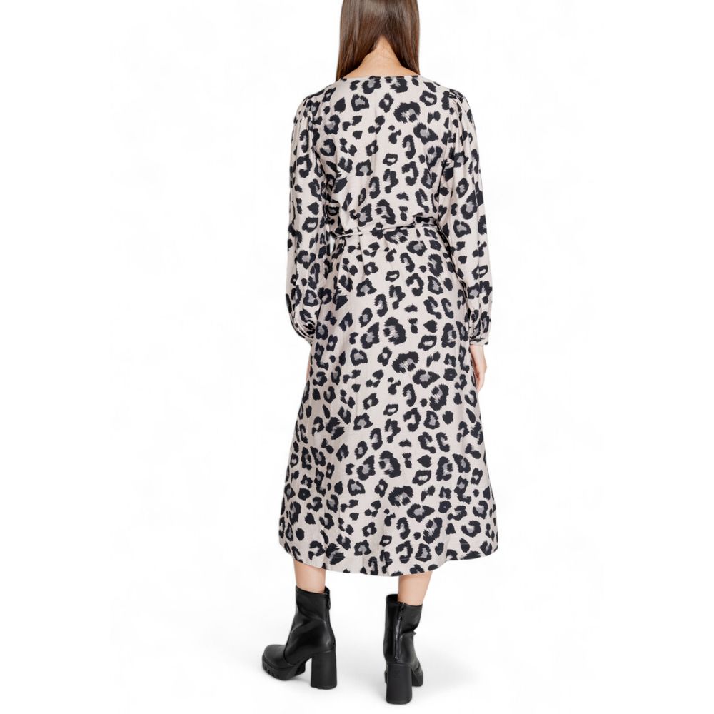 Dress by Jacqueline De Yong for women in viscose & nylon gray & leopard-print features an cute silhouette, detailed with a and v-neck neckline that elegantly flows into a cute midi long.