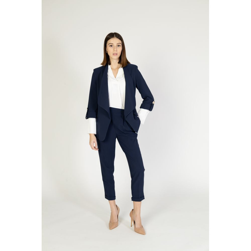 Suit by Rinascimento for women in polyester blue showcases a tailored silhouette, artfully defined by its and tailored .