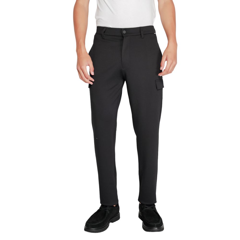 Activewear Jogger Pants by Calvin Klein for men in stretch polyester & viscose black features a contemporary silhouette with , a contemporary tapered-leg, long hem, and for a premium, high-performance aesthetic.