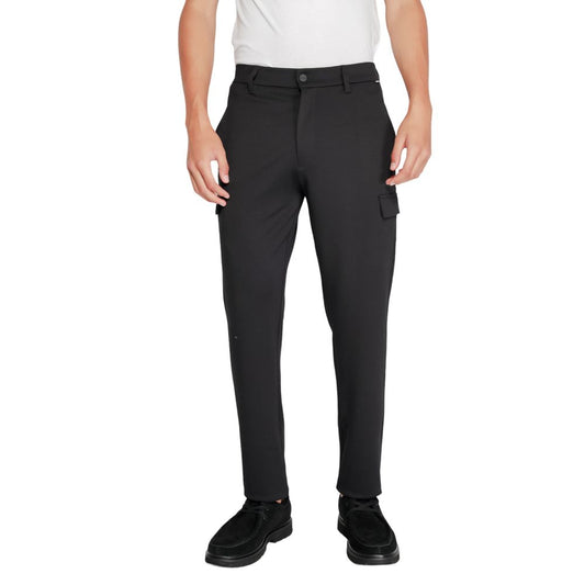 Activewear Jogger Pants by Calvin Klein for men in stretch polyester & viscose black features a contemporary silhouette with , a contemporary tapered-leg, long hem, and for a premium, high-performance aesthetic.