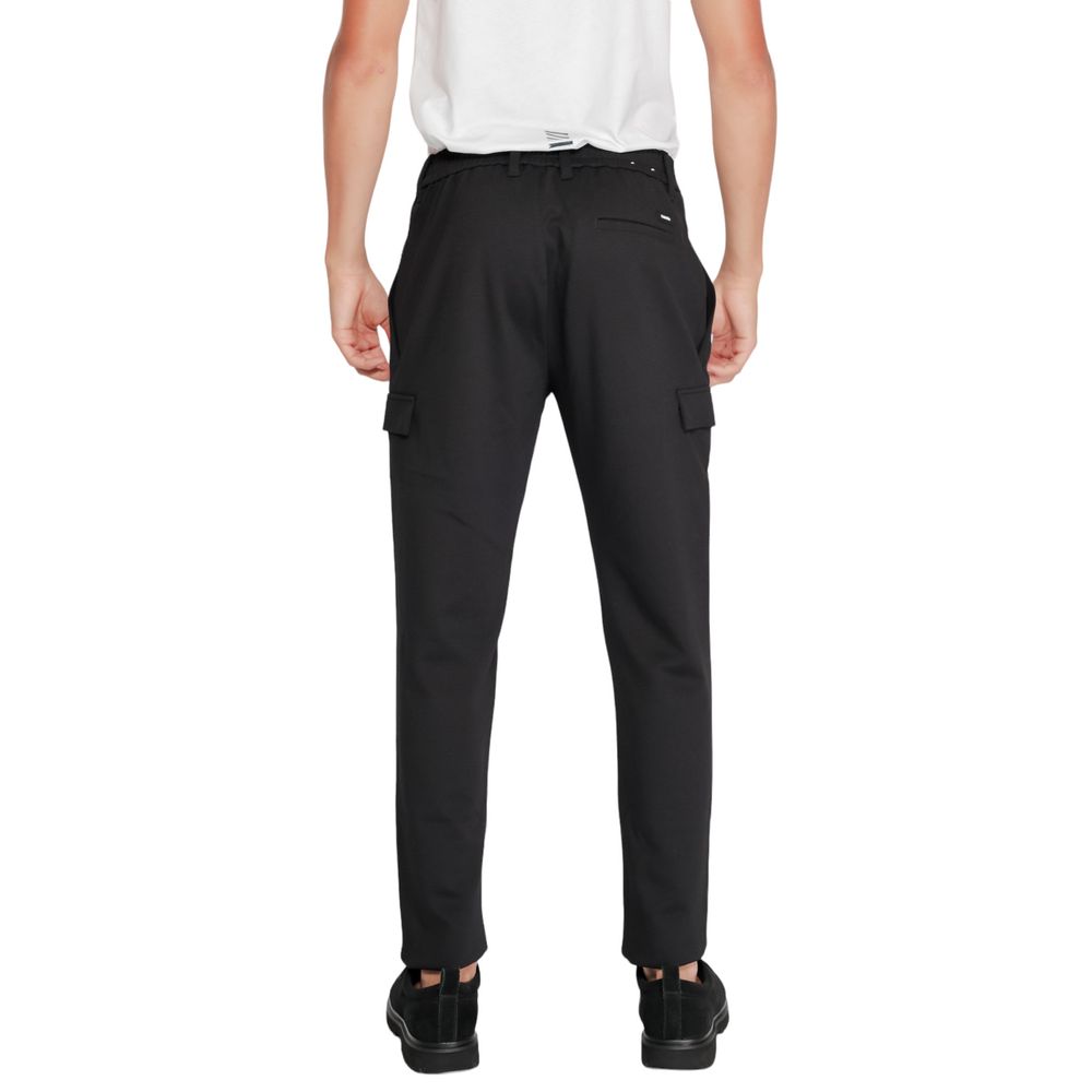Activewear Jogger Pants by Calvin Klein for men in stretch polyester & viscose black features an sporty tapered-leg with a and long, showcasing sporty .
